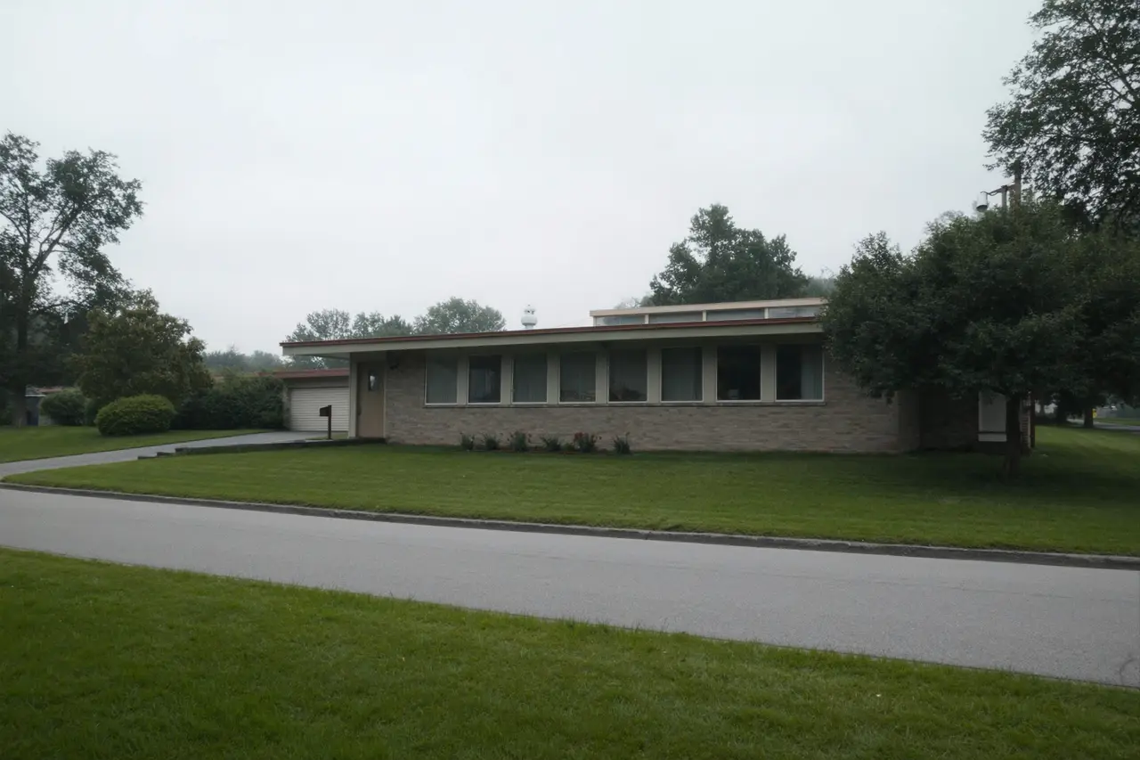 Rendered image of a 1960s split-level house on a wide lot