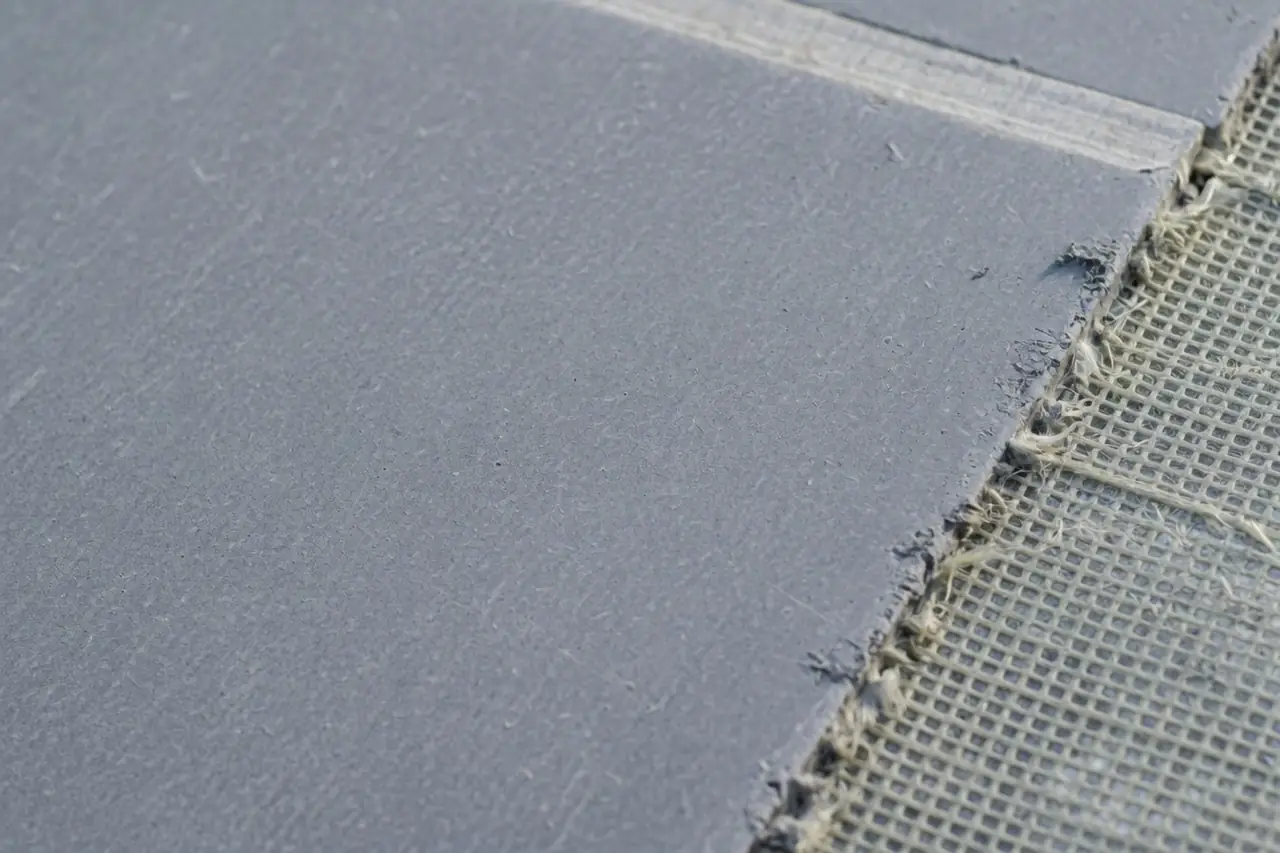 Close-up of a cement board face and mesh edge