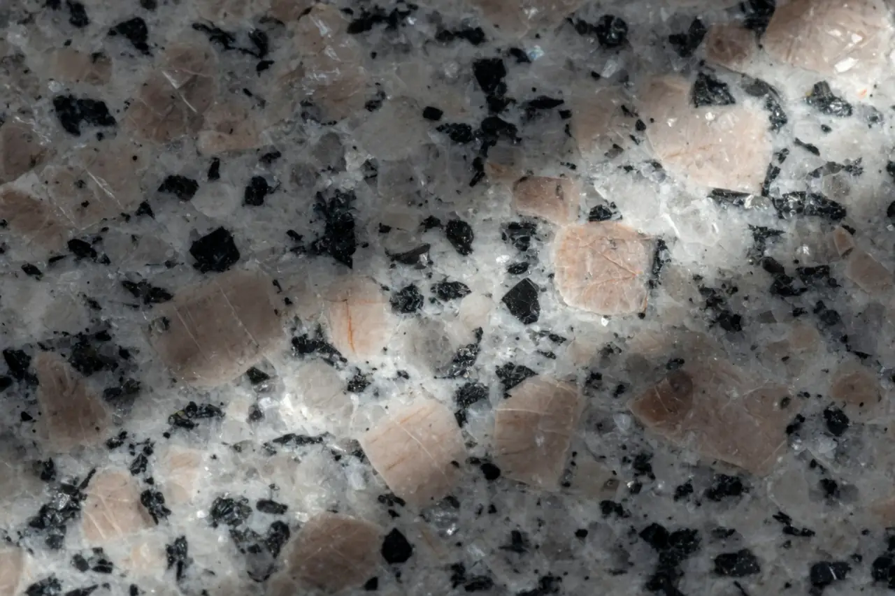 Close-up of a polished granite face with mixed mineral crystals
