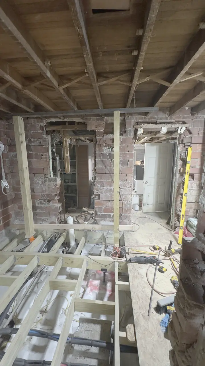 Brick basement gutted and framed for a new bathroom.